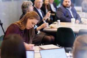 PMCR attendee taking notes